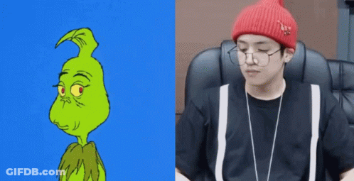 A Cartoon Of The Grinch Next To A Picture Of A Man Wearing Glasses And A Beanie GIF