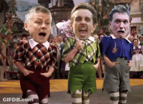 A Cartoon Of Three Men Standing Next To Each Other With Their Faces On Their Shirts GIF