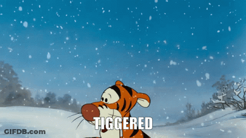 A Cartoon Of Tigger Standing In The Snow With The Word Tiggered Above Him GIF