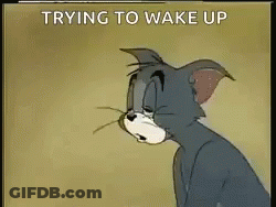A Cartoon Of Tom Trying To Wake Up With The Words Trying To Wake Up Below Him . GIF
