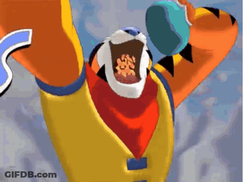 A Cartoon Of Tony The Tiger Holding A Bowl Of Cereal In His Mouth GIF