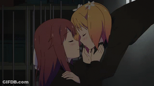 A Cartoon Of Two Girls Kissing With Their Eyes Closed GIF