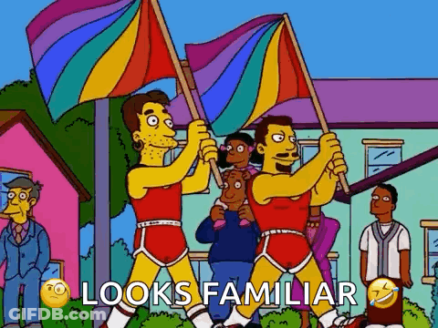 A Cartoon Of Two Men Holding Rainbow Flags With The Words Looks Familiar Below Them . GIF