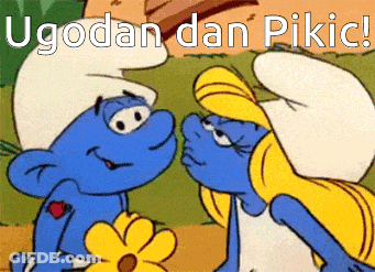 A Cartoon Of Two Smurfs Kissing With The Words Ugodan Dan Pikic Written Above Them GIF