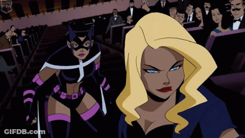 A Cartoon Of Two Women Standing Next To Each Other With The Word Fm On The Bottom Right GIF