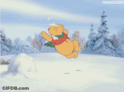 A Cartoon Of Winnie The Pooh Playing In The Snow With The Words Trendizisst Below Him GIF
