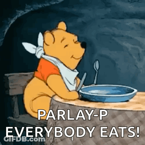 A Cartoon Of Winnie The Pooh Sitting At A Table With A Bowl Of Food And A Spoon In His Mouth . GIF
