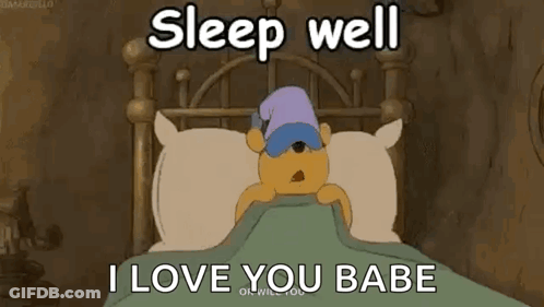 A Cartoon Of Winnie The Pooh Sleeping In A Bed With A Hat On . GIF
