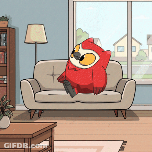 A Cartoon Owl Is Sitting On A Couch In A Living Room GIF