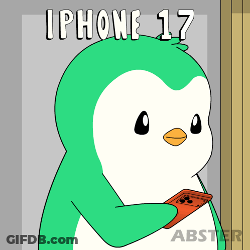A Cartoon Penguin Is Holding An Iphone 17 GIF