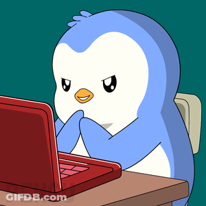 A Cartoon Penguin Is Sitting At A Desk Using A Laptop GIF
