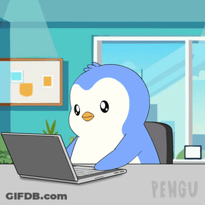 A Cartoon Penguin Is Sitting At A Desk With A Laptop GIF