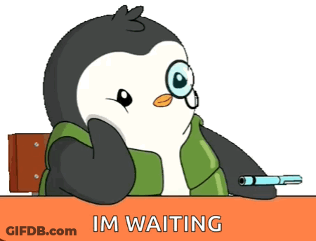 A Cartoon Penguin Is Sitting At A Desk With The Words Im Waiting Below Him GIF