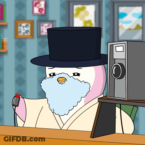 A Cartoon Penguin With A Top Hat And A Beard GIF
