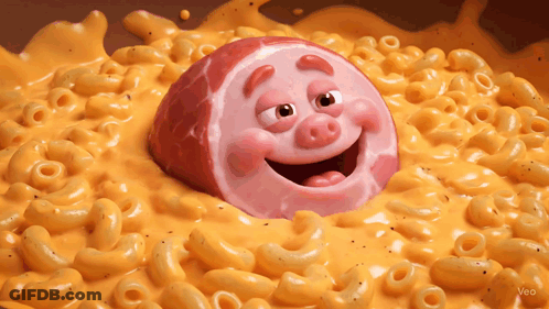 A Cartoon Pig Is In A Bowl Of Macaroni And Cheese GIF