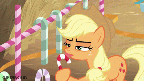 A Cartoon Pony Is Holding A Candy Cane In Its Mouth GIF