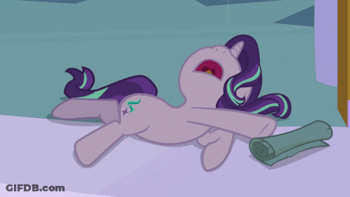 A Cartoon Pony Is Laying On The Floor With Its Mouth Wide Open GIF