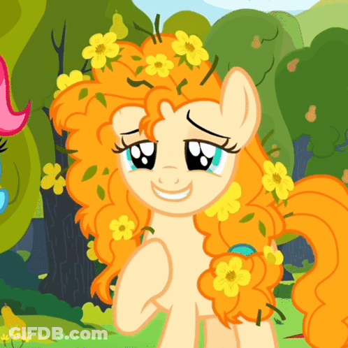 A Cartoon Pony With Orange Hair And Yellow Flowers On It GIF