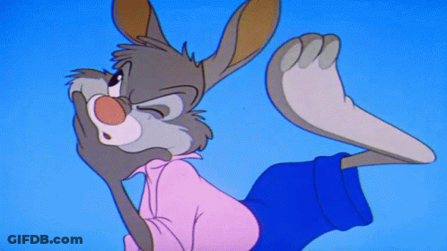 A Cartoon Rabbit In A Pink Shirt And Blue Shorts Covering His Mouth GIF