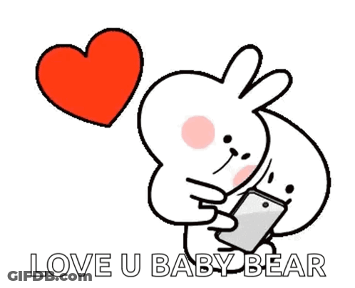 A Cartoon Rabbit Is Holding A Cell Phone And A Heart Is Flying In The Background . GIF