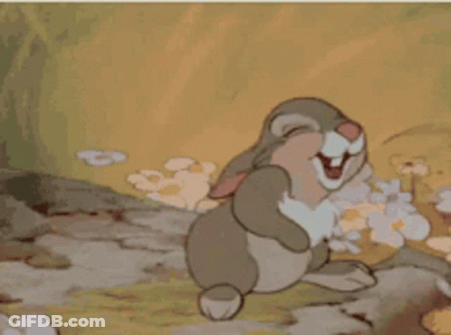 A Cartoon Rabbit Is Laughing And Covering Its Face With Its Paws GIF