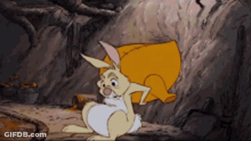 A Cartoon Rabbit Is Sitting On A Rock With A Yellow Pillow On Its Back GIF