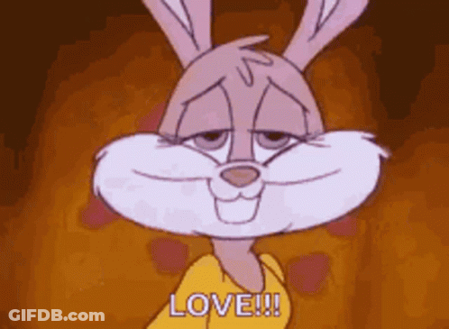 A Cartoon Rabbit Is Smiling And Says Love . GIF