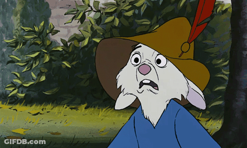 A Cartoon Rabbit Wearing A Hat With A Red Feather GIF