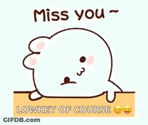 A Cartoon Seal Is Laying On The Ground With The Words `` Miss You '' Written On It . GIF