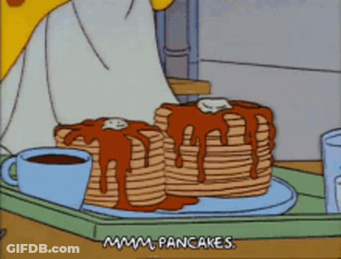A Cartoon Shows A Stack Of Pancakes On A Tray GIF