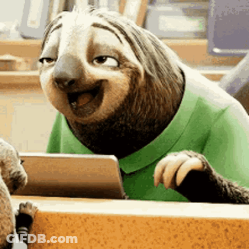 A Cartoon Sloth Wearing A Green Shirt Is Sitting At A Table . GIF