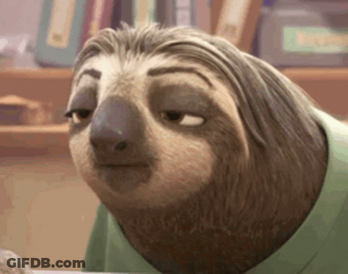A Cartoon Sloth Wearing A Green Shirt Is Sitting At A Table . GIF