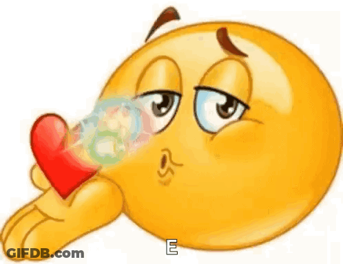 A Cartoon Smiley Face Is Blowing A Kiss And Holding A Red Heart In Its Hand . GIF