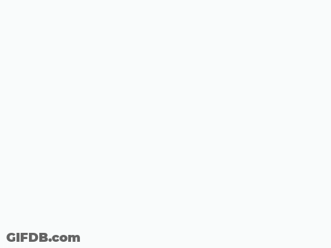 A Cartoon Smiley Face Is Making A Funny Face And Pointing At The Camera . GIF