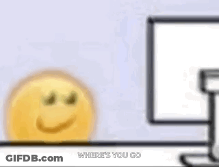 A Cartoon Smiley Face Is Sitting In Front Of A Computer Screen . GIF