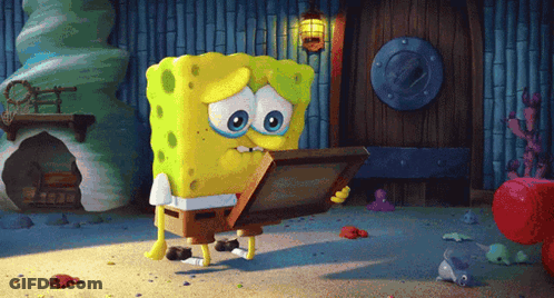 A Cartoon Spongebob Holding A Picture In His Hand GIF