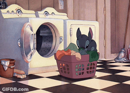 A Cartoon Stitch Is Sitting In A Laundry Basket GIF