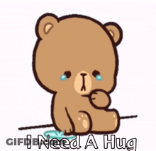 A Cartoon Teddy Bear Is Crying And Saying I Need A Hug GIF