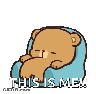 A Cartoon Teddy Bear Is Sitting On A Blue Pillow With The Words `` This Is Me '' . GIF