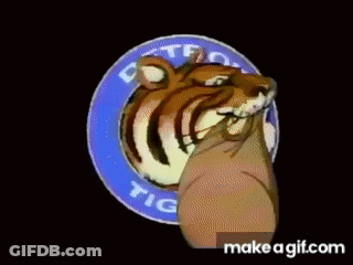 A Cartoon Tiger Is Holding A Sign That Says Detroit Tigers On It GIF