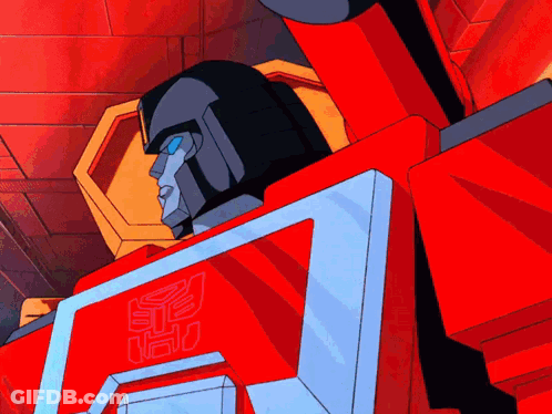 A Cartoon Transformer Is Waving His Hand In Front Of A Computer Screen GIF
