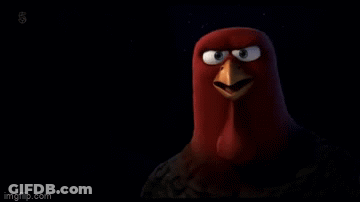 A Cartoon Turkey With A Big Beak Is Looking At The Camera With A Black Background . GIF