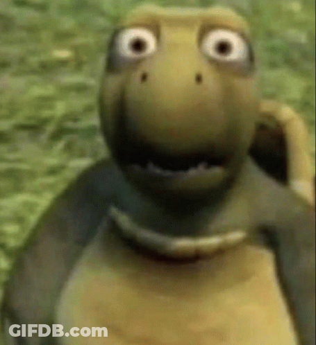A Cartoon Turtle With Big Eyes Is Standing In The Grass And Smiling . GIF