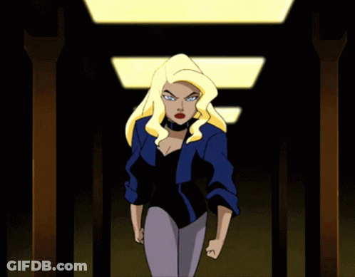 A Cartoon Woman With Blonde Hair And Blue Eyes Is Wearing A Blue Shirt GIF