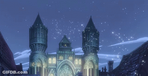 A Castle Is Lit Up At Night With A Blue Sky Behind It GIF