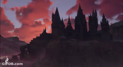 A Castle Is Silhouetted Against A Cloudy Sky With The Letters Nmx Visible GIF