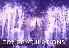 A Castle Is Surrounded By Fireworks And The Words `` Congratulations '' Are Displayed . GIF