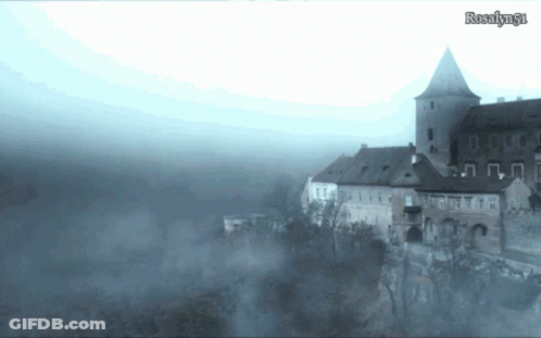 A Castle Is Surrounded By Fog And The Name Rosalyn61 Is On The Bottom Of The Screen GIF