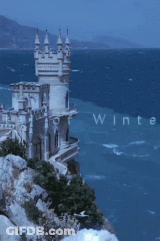 A Castle On A Cliff Overlooking The Ocean With The Words Capital Of Winteress GIF