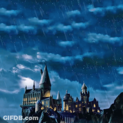 A Castle On Top Of A Hill With A Blue Sky And Rain GIF